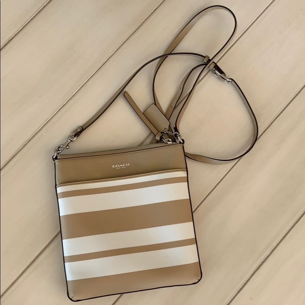 Tan and white Coach cross body